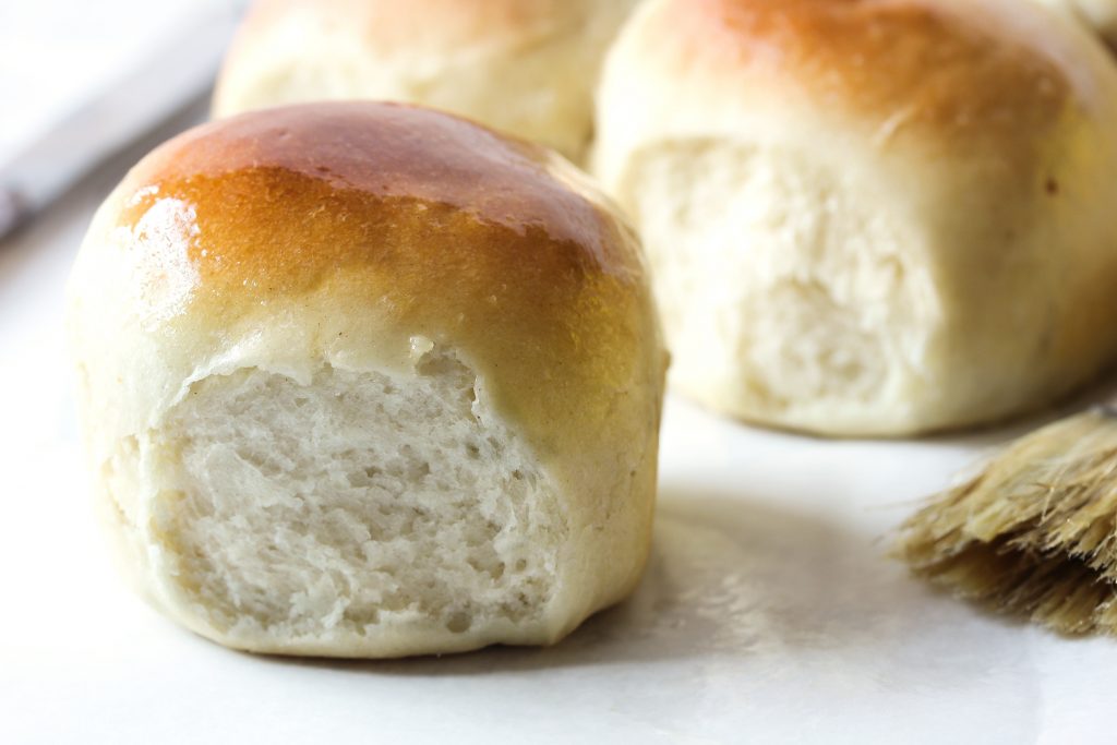 homemade rolls on a white surface