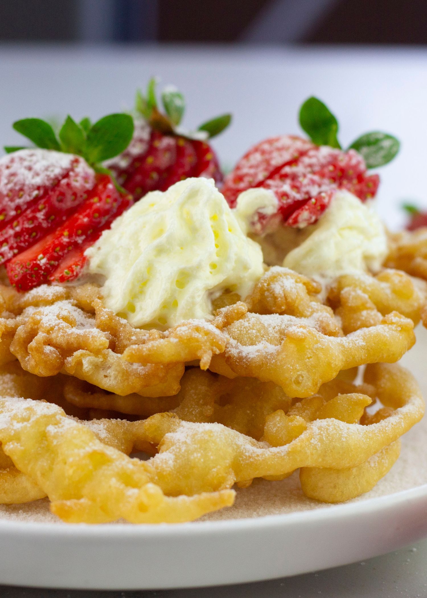 easy funnel cake on a white plate