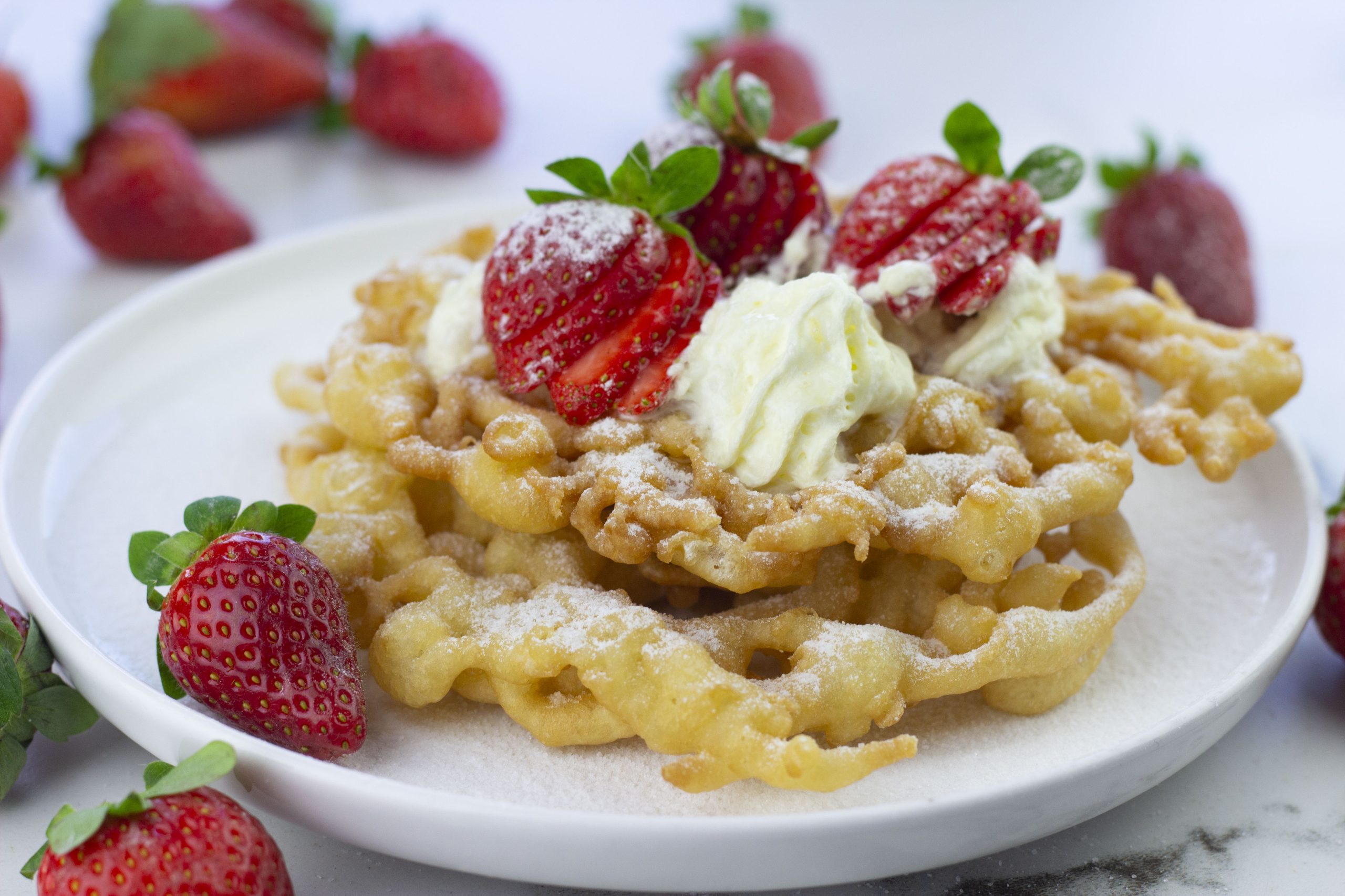 3 ingredient funnel cake on a white plate
