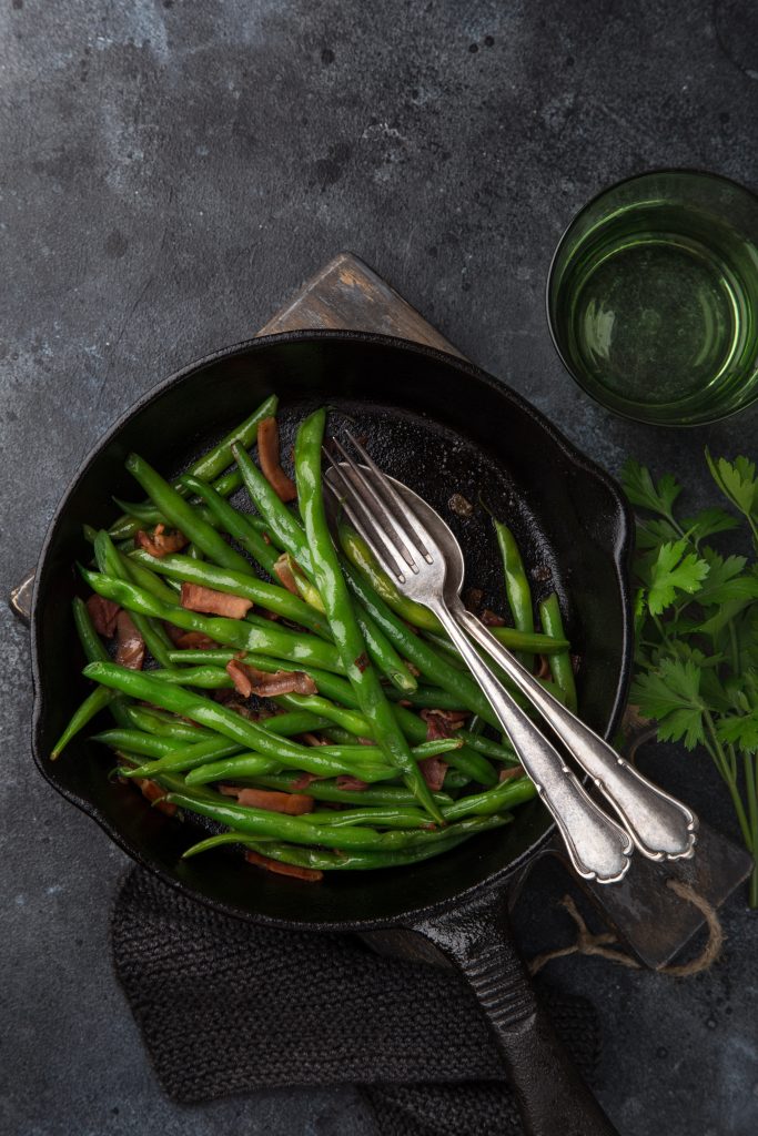 green beans and bacon in a skillet