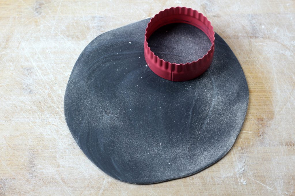 rolled fondant being cut into circles