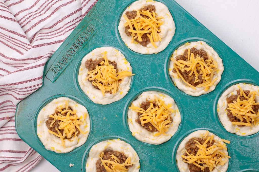 muffin pan with biscuits, ground beef and cheese