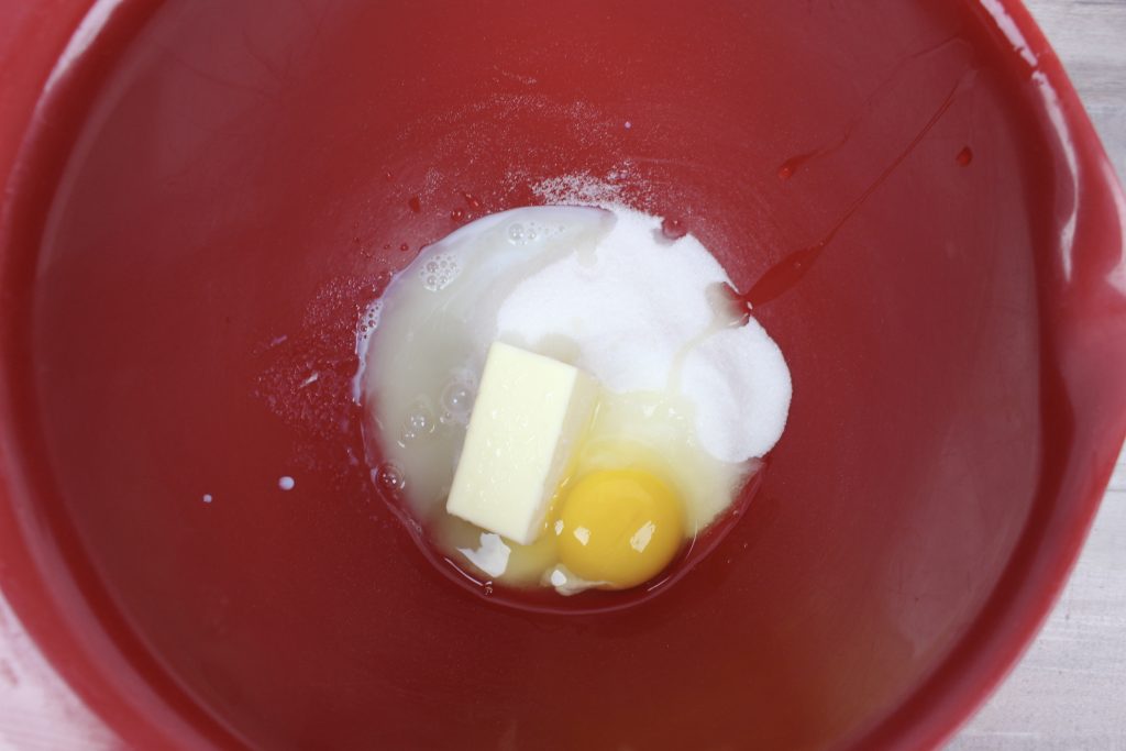butter, sugar, egg in a bowl