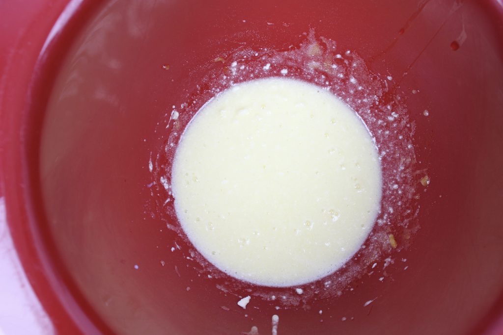 cookie batter in a red bowl