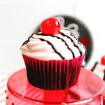 Chocolate Cherry Cupcake on a red cupcake stand