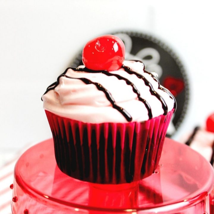 Chocolate Cherry Cupcake on a red cupcake stand