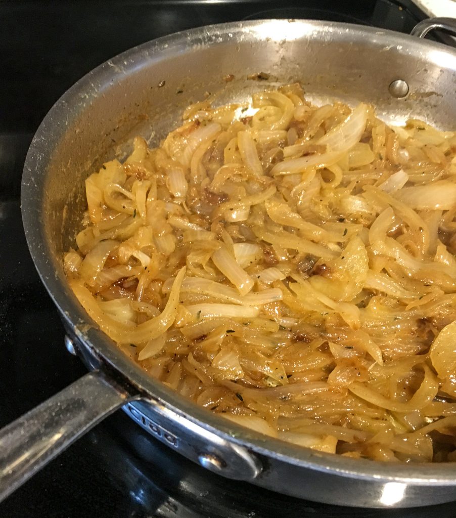 Dark and rich caramelized onions in a skillet