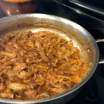 Savory Caramelized Onions in a skillet on the stove