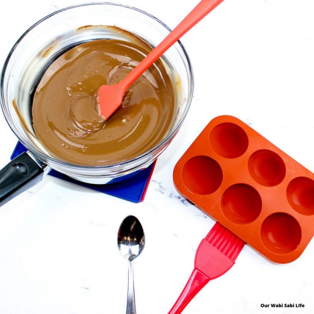 Melted chocolate and chocolate mold to make hot chocolate mold