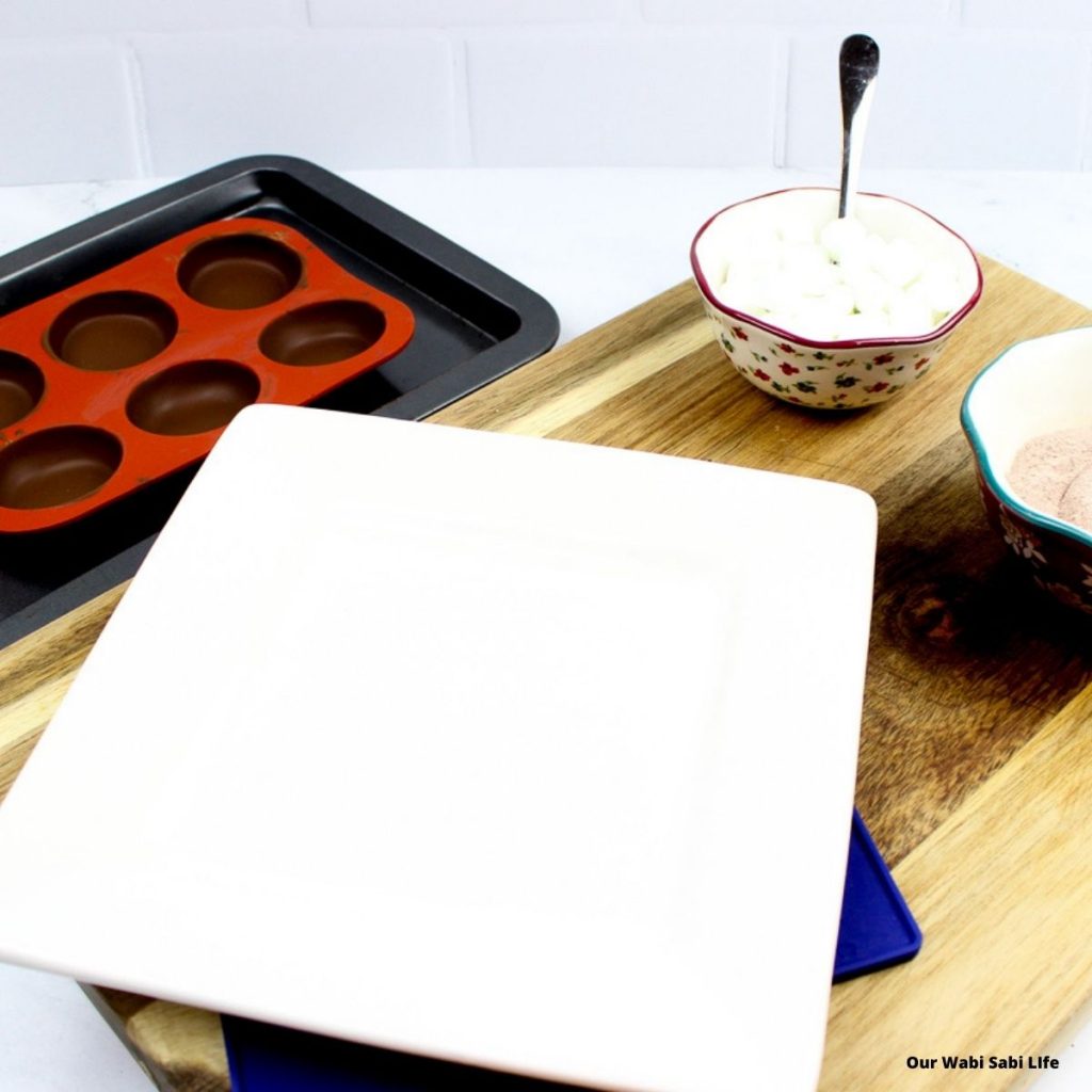 warm plate to melt edges of the hot chocolate bombs after they've set