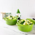 Two small green pots of Irish Colcannon with a little gnome and an Irish sign