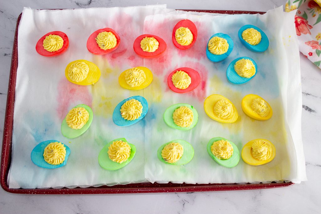 colored boiled eggs on a tray