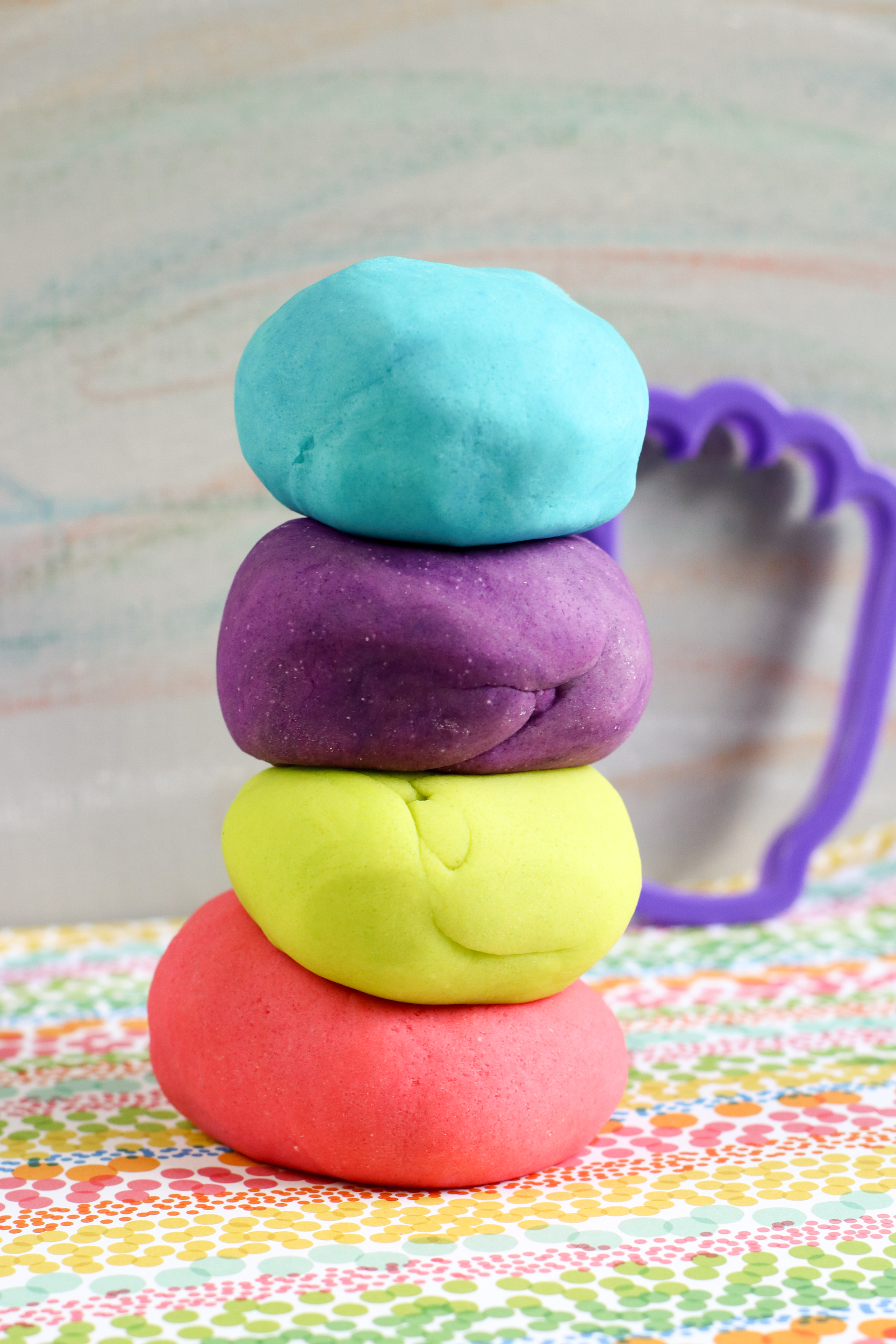 A close up of the playdough stacked on top of each other.