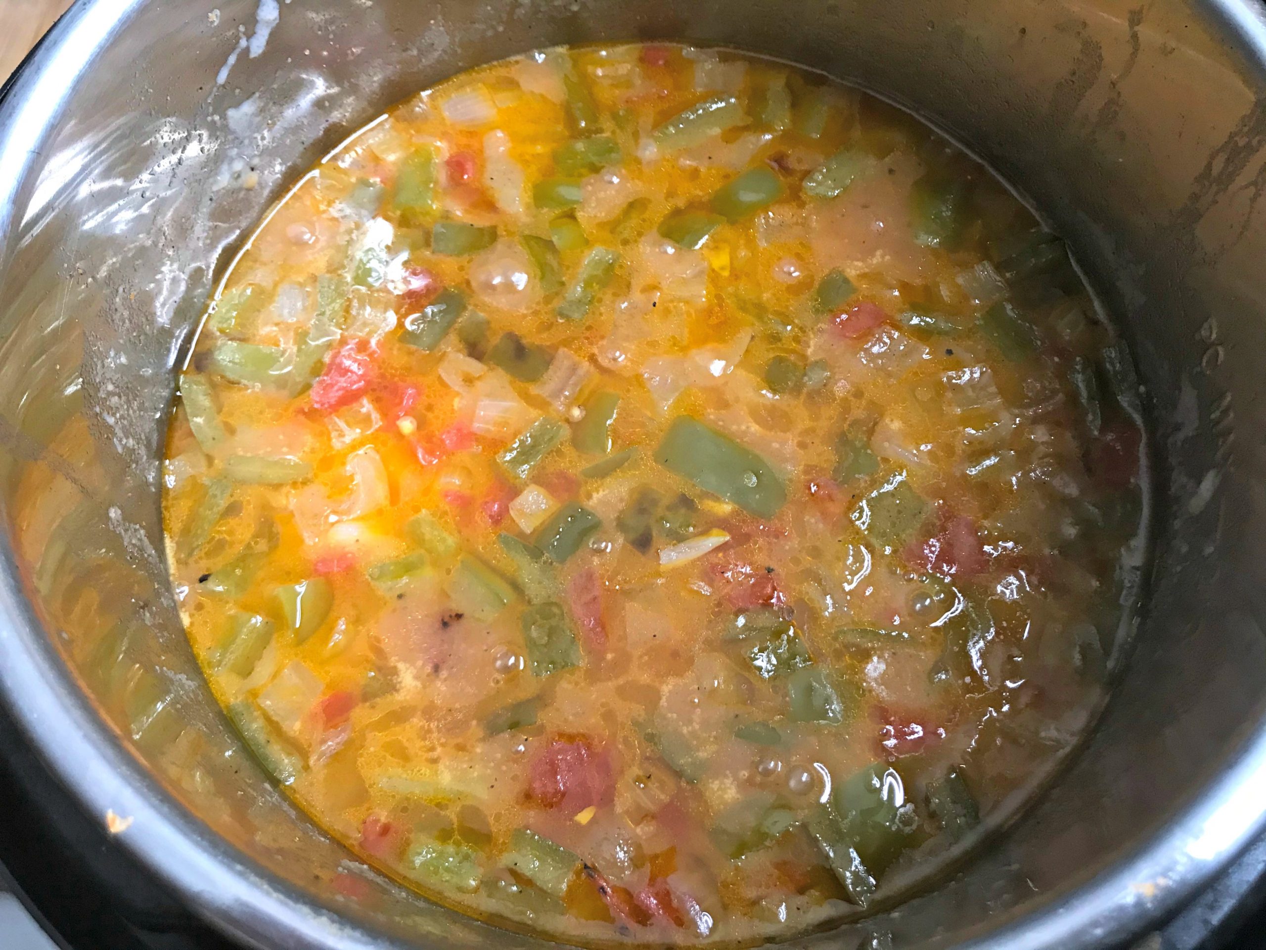 Ingredients cooking in pot with the broth.