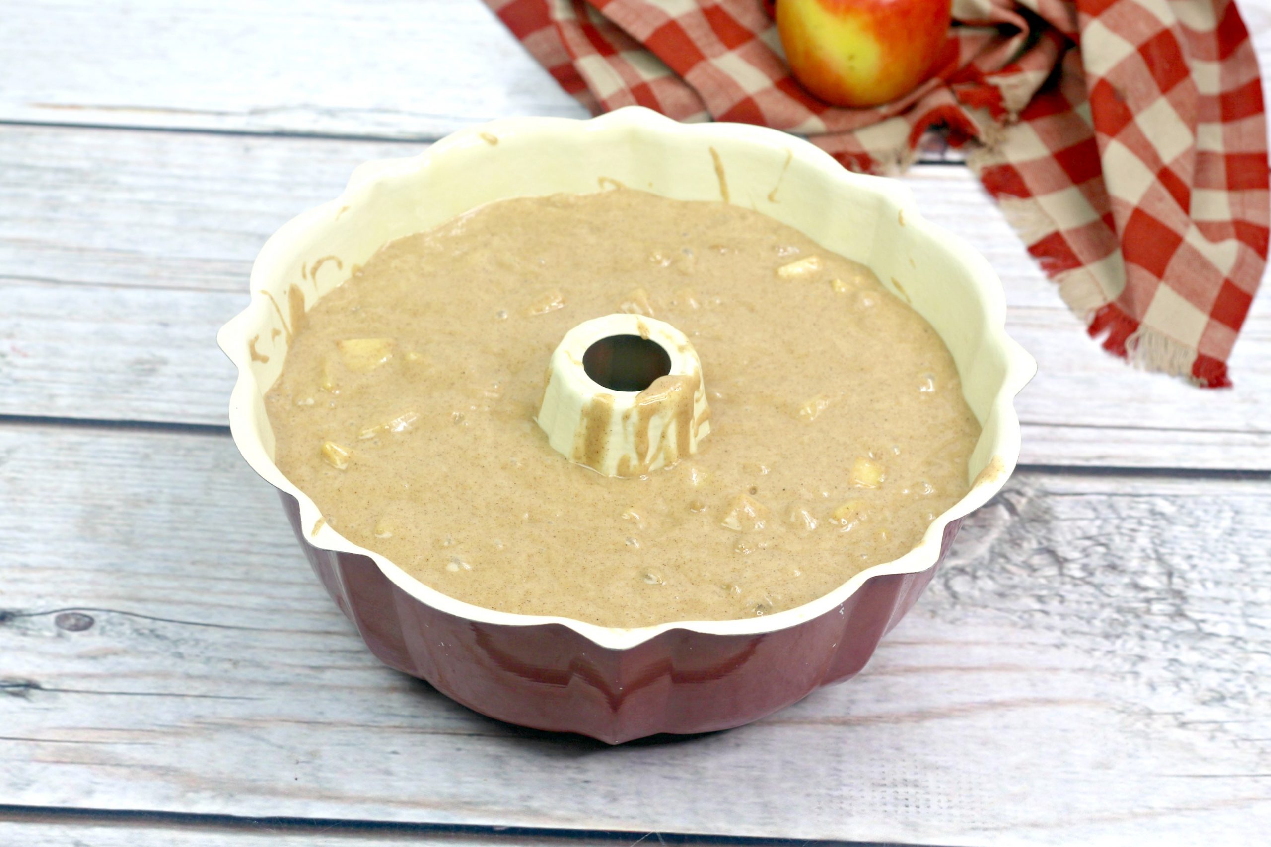 The apple batter in the Bundt pan.