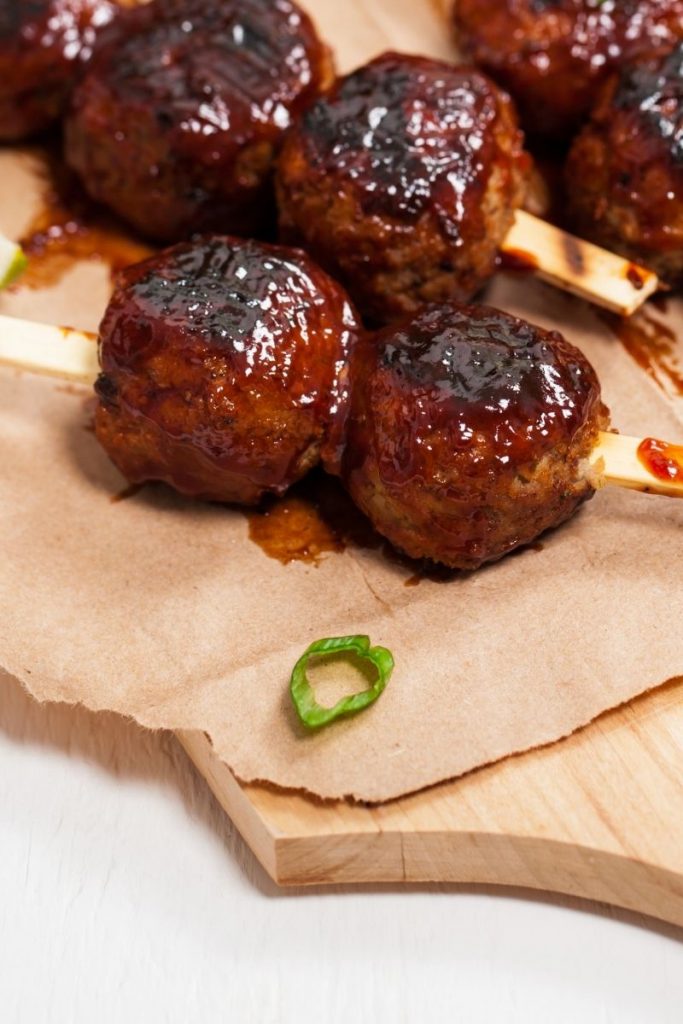 BBQ meatballs with a green onion