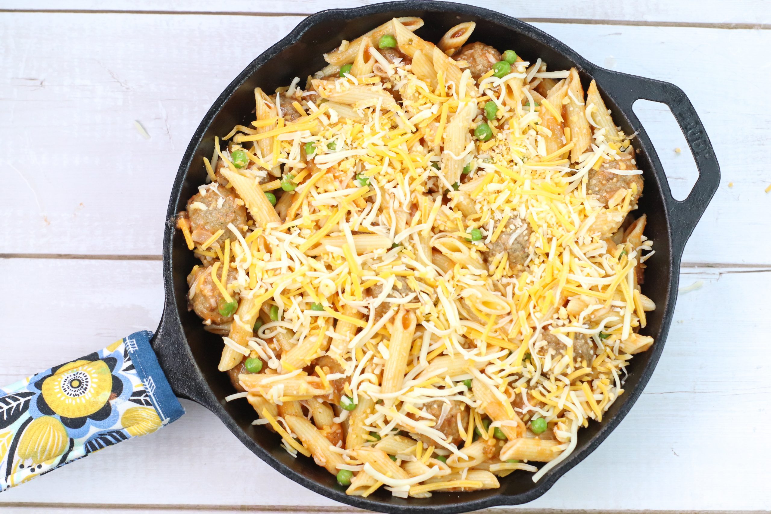 skillet meatball pasta topped with cheese