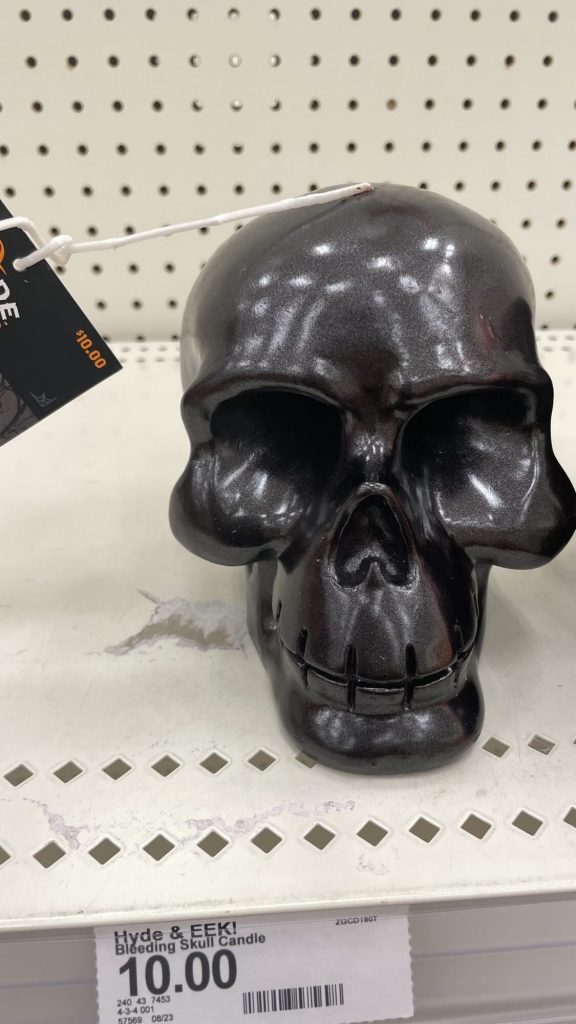 The skull candle on the target shelf.