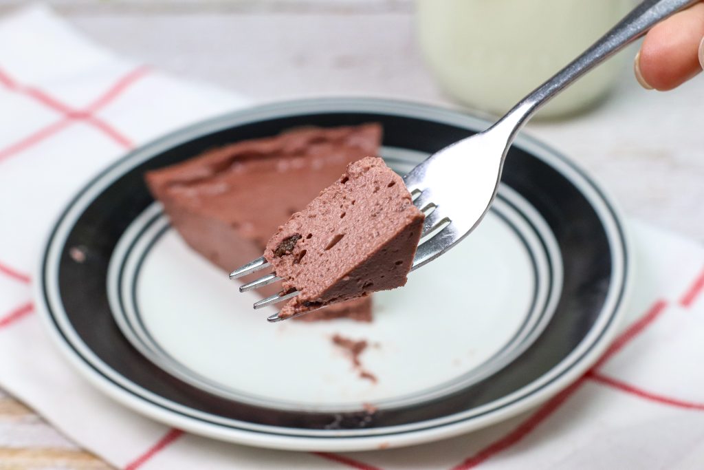 chocolate cheesecake with a bite on teh fork