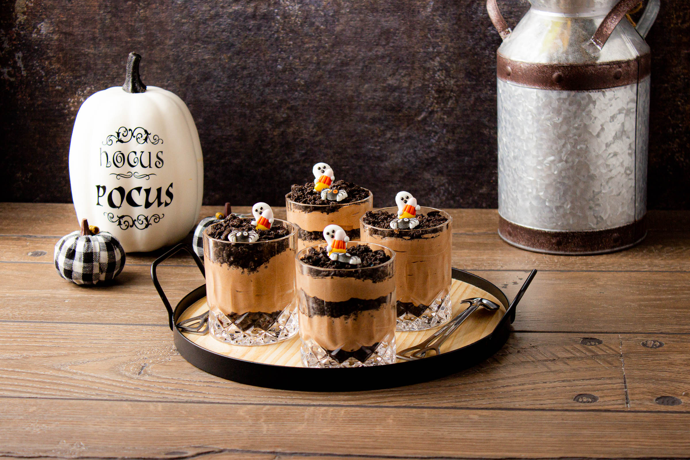 Halloween dirt pudding cups with ghost decorations on top