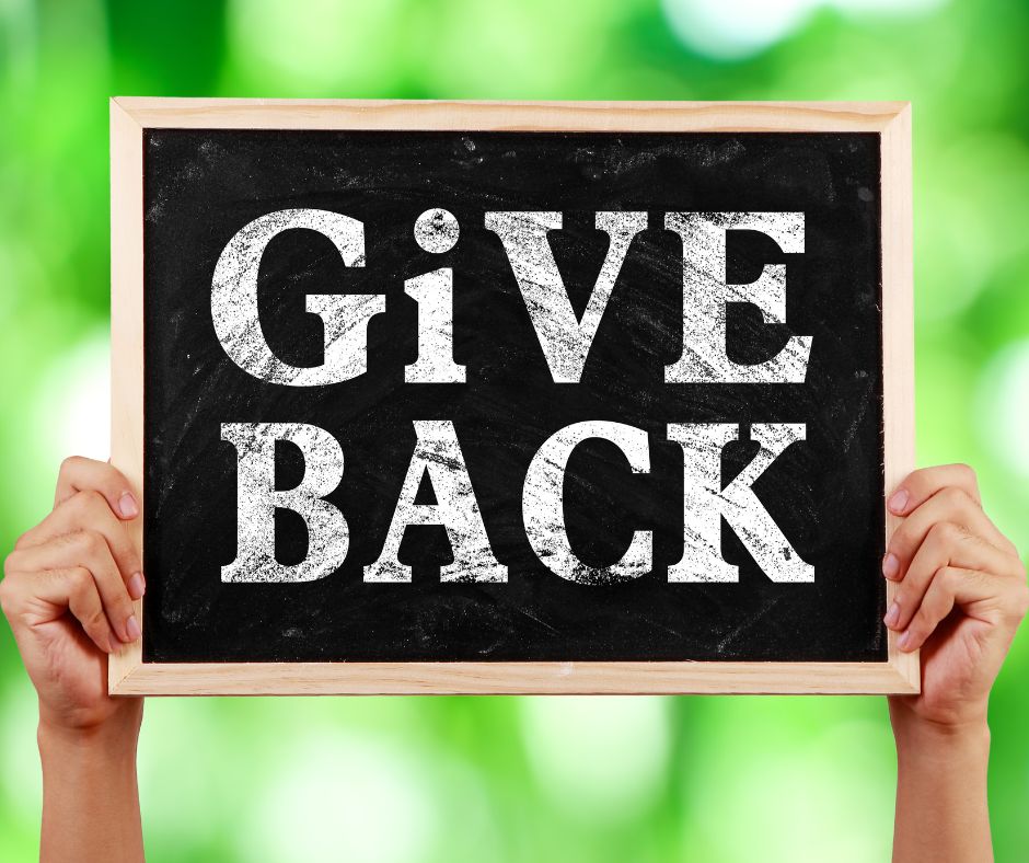 Give back sign in someone's hands