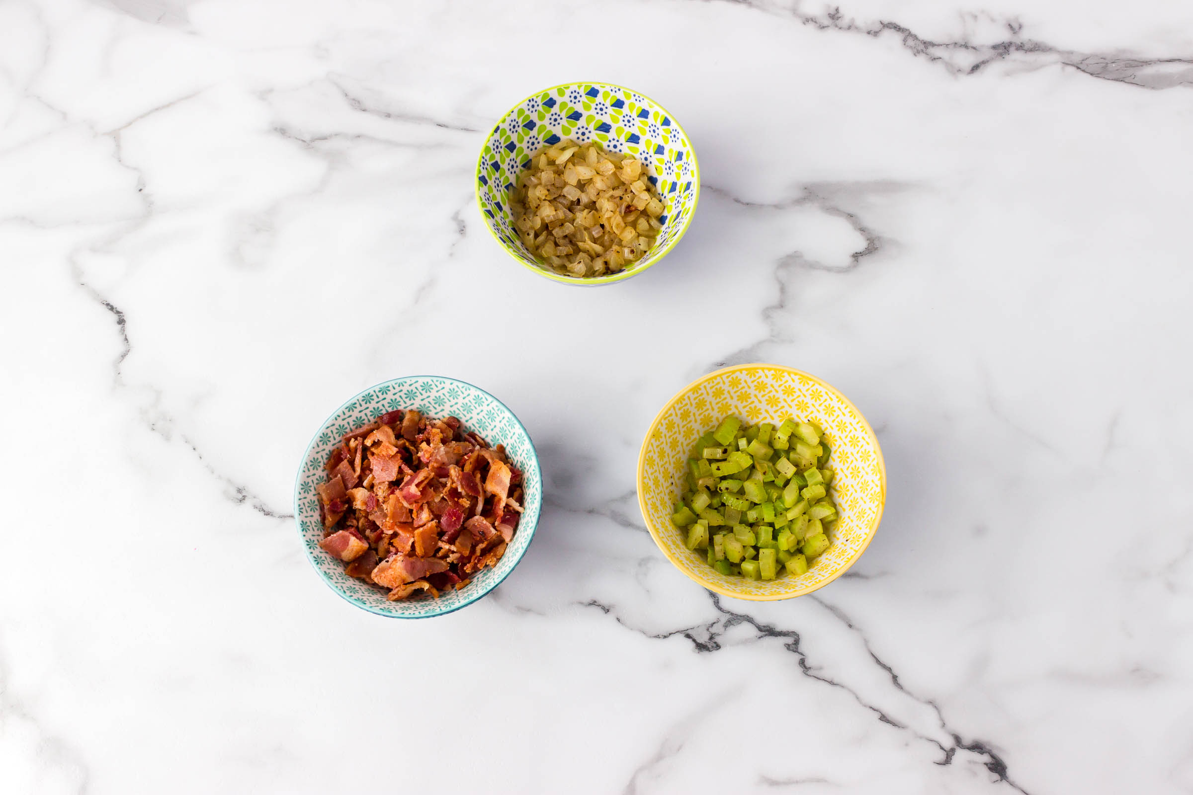 tender veggies and bacon in bowls