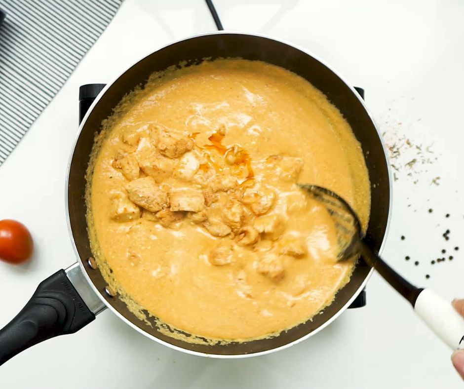 the butter chicken in  a pan