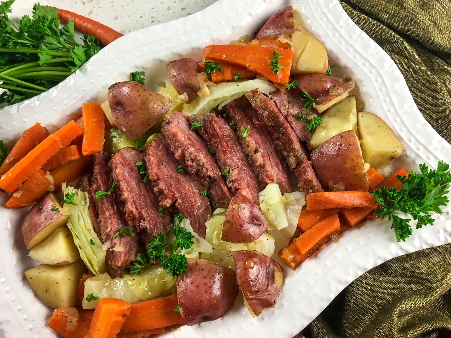 Instant Pot Corned Beef and Cabbage with Guinness on a white plate