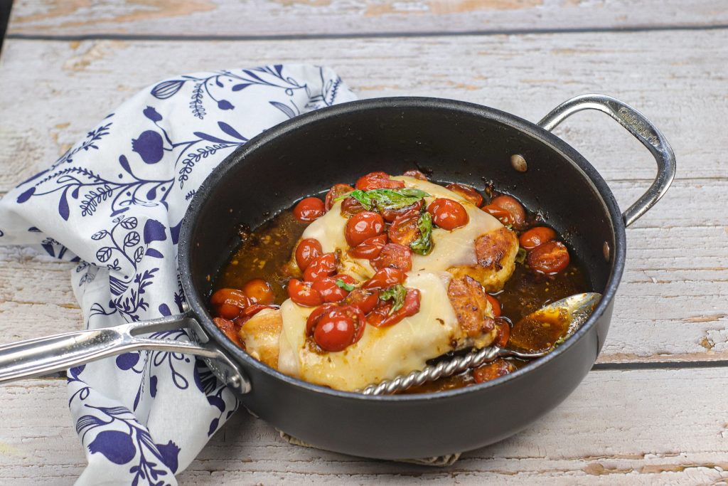 caprese chicken in a pan