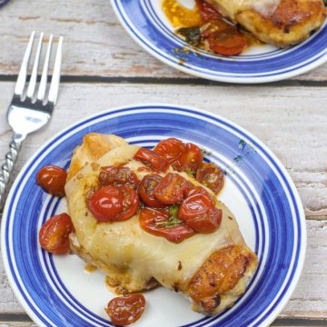 caprese chicken on a white and blue plate