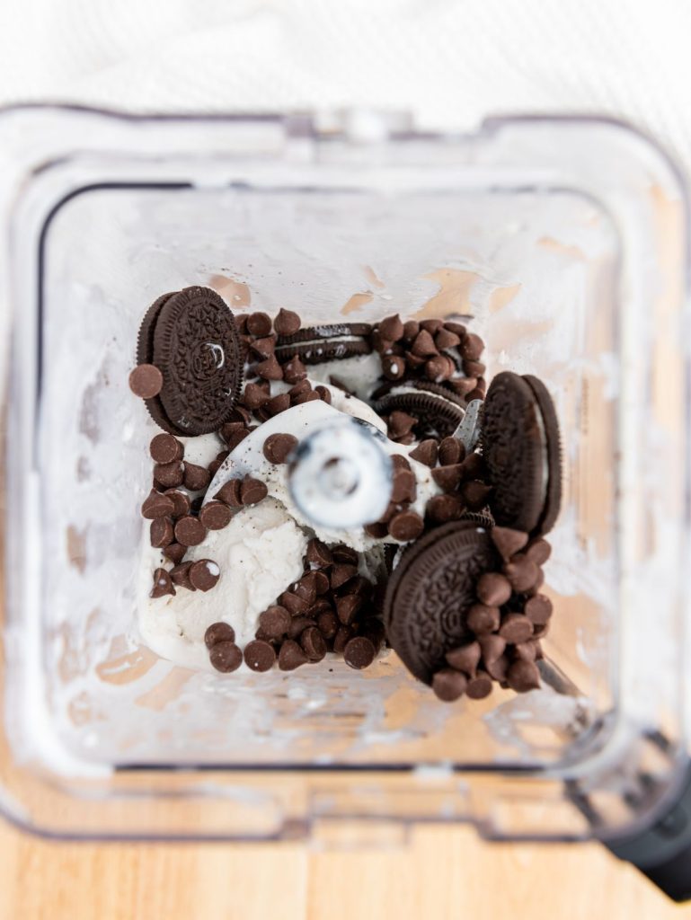 Oreos, ice cream and chocolate chips in the blenfer