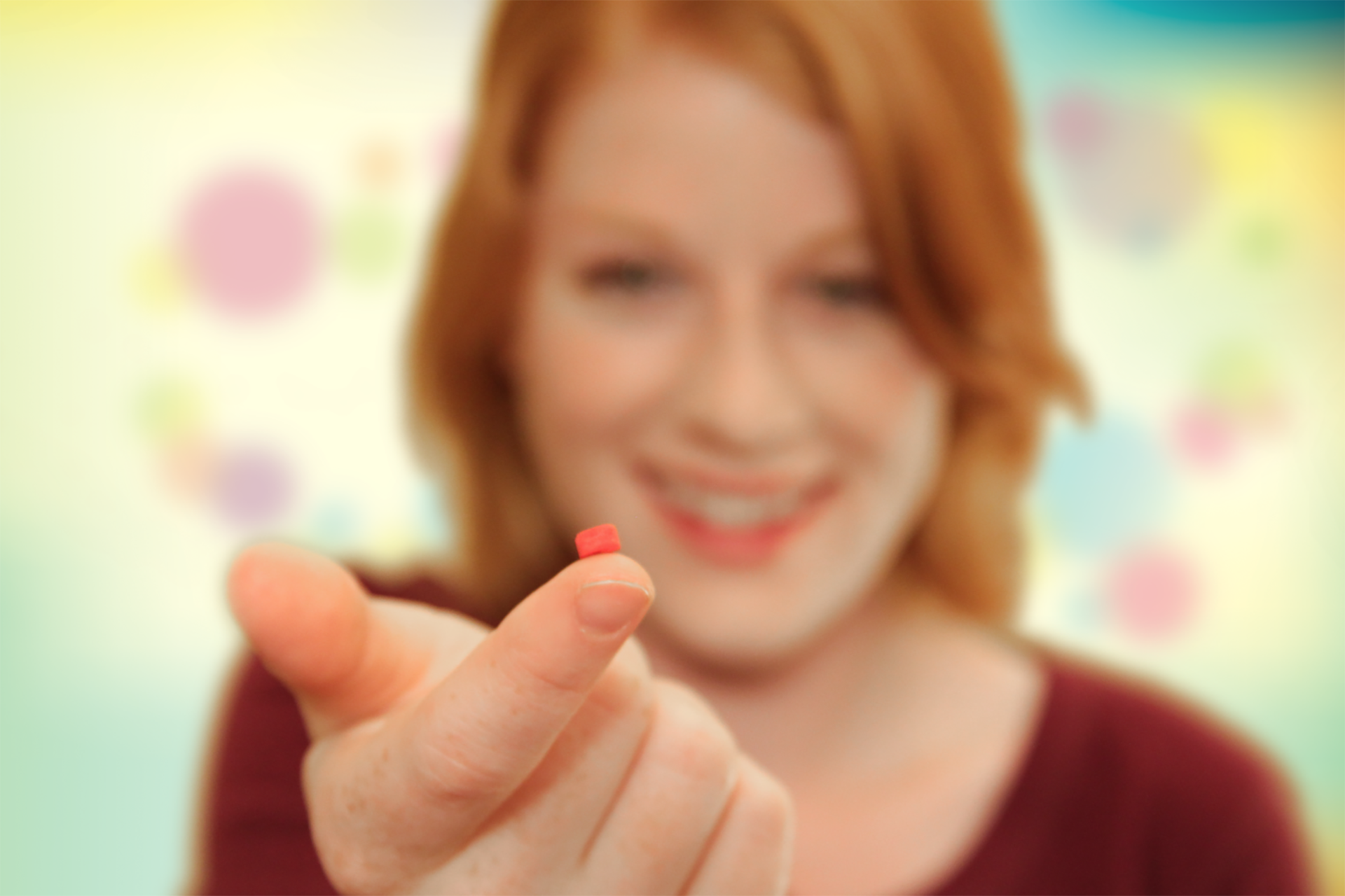 woman holding pill