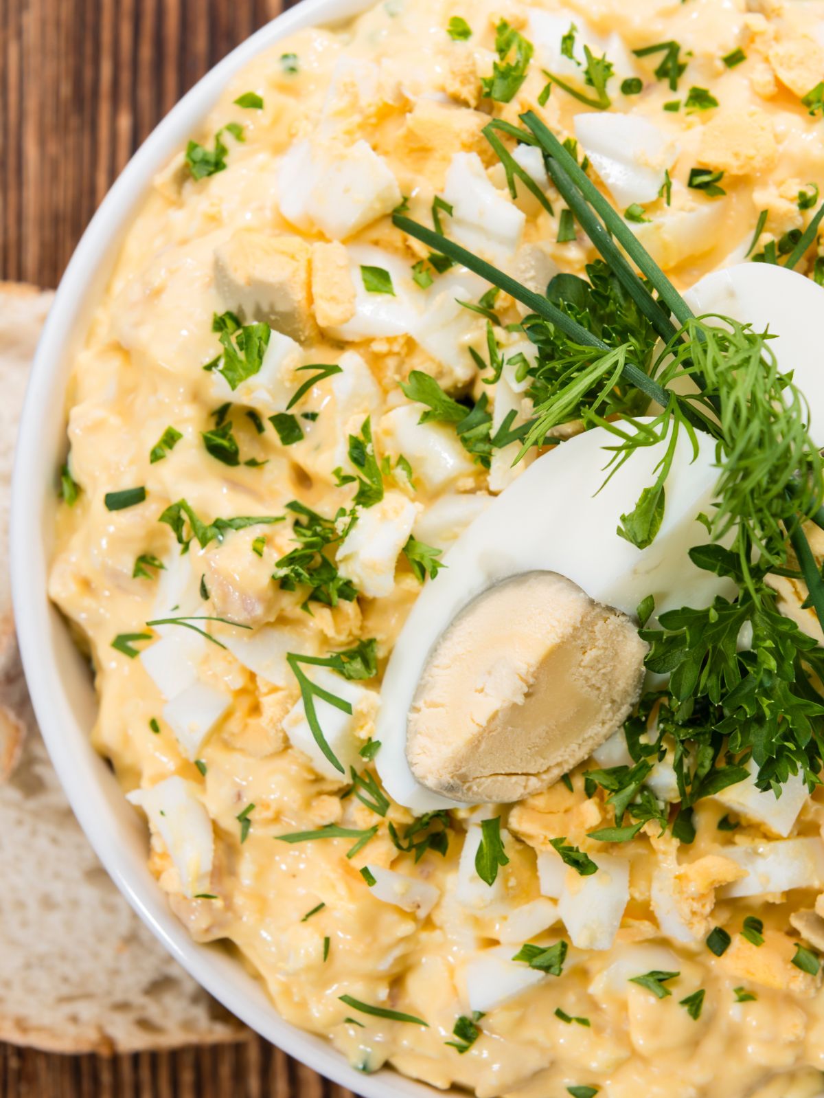 overhead of egg salad in a white bowl