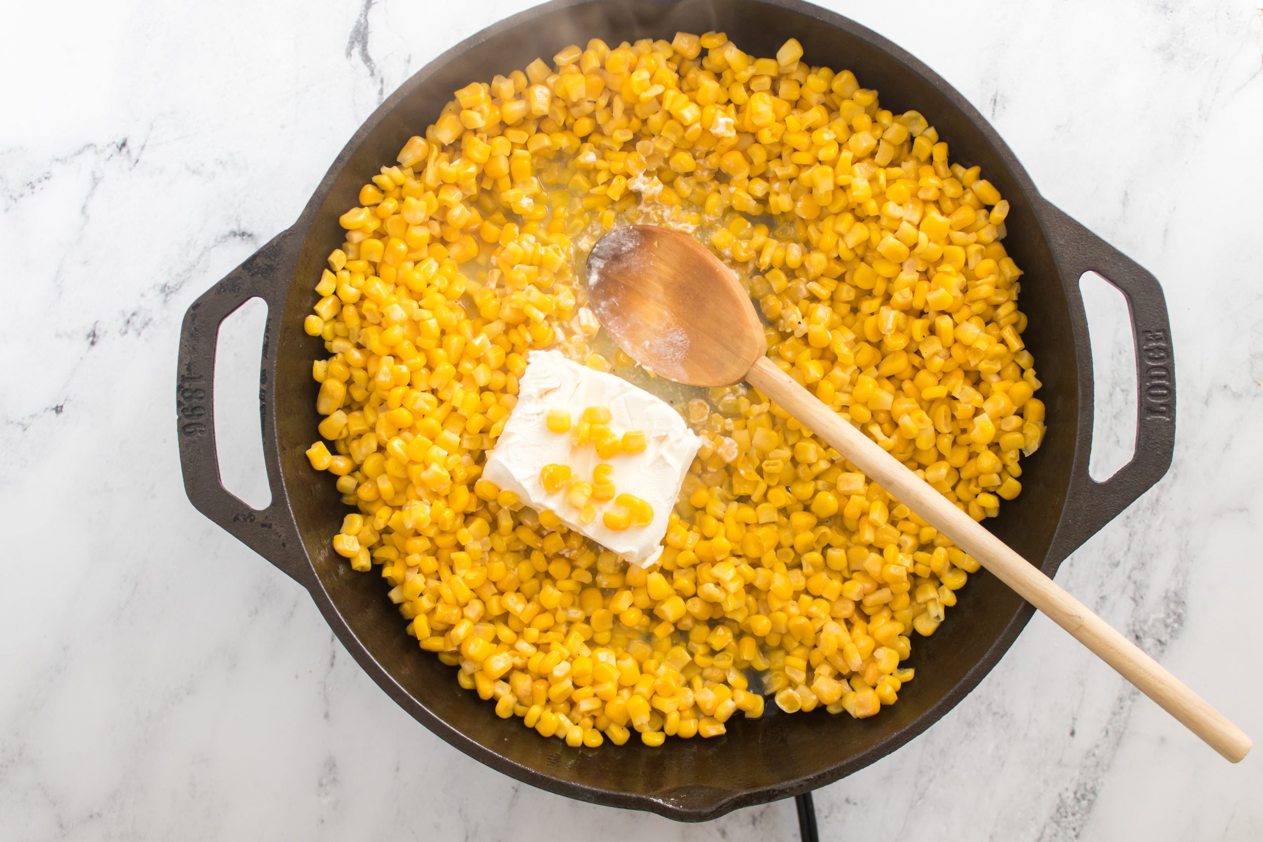 cream cheese and corn in the skillet