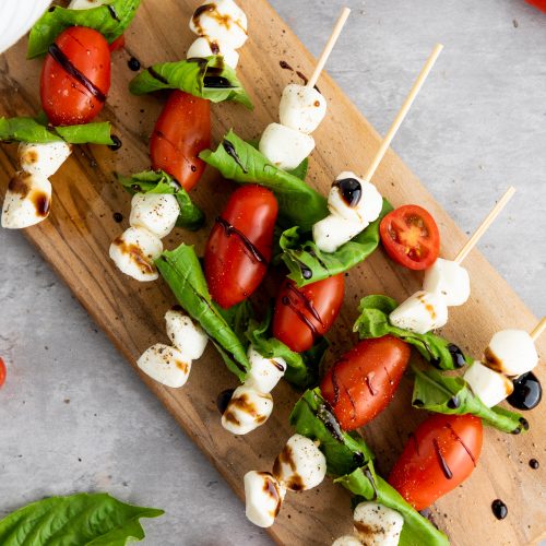 caprese skewers on a board