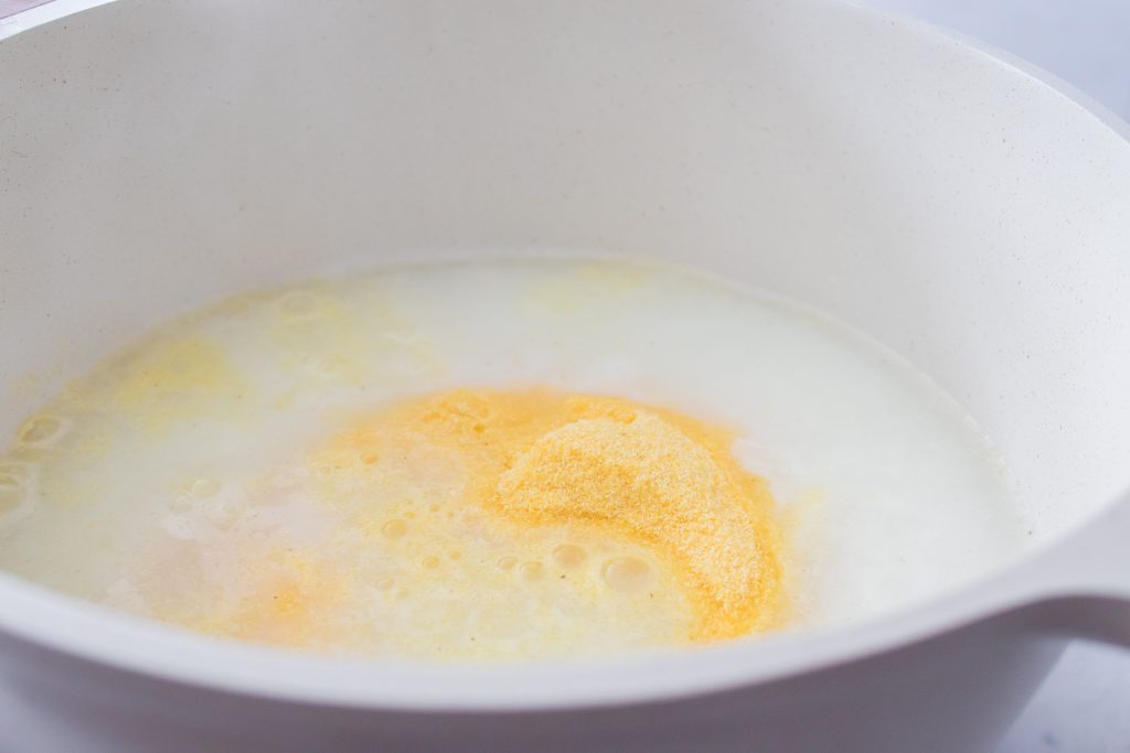milk and grits in a bowl