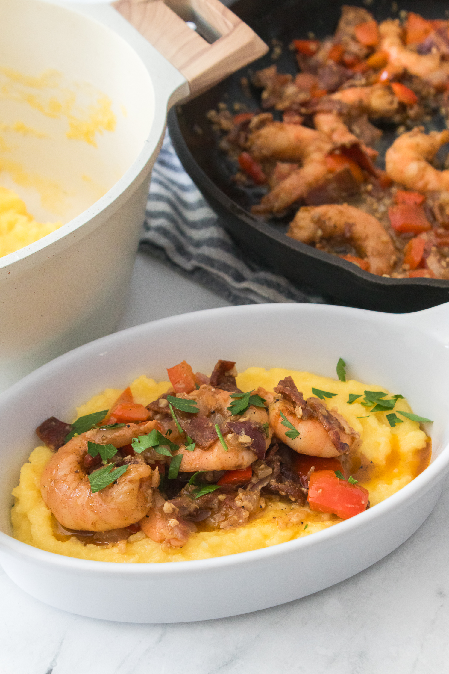 shrimp and grits in a white bowl