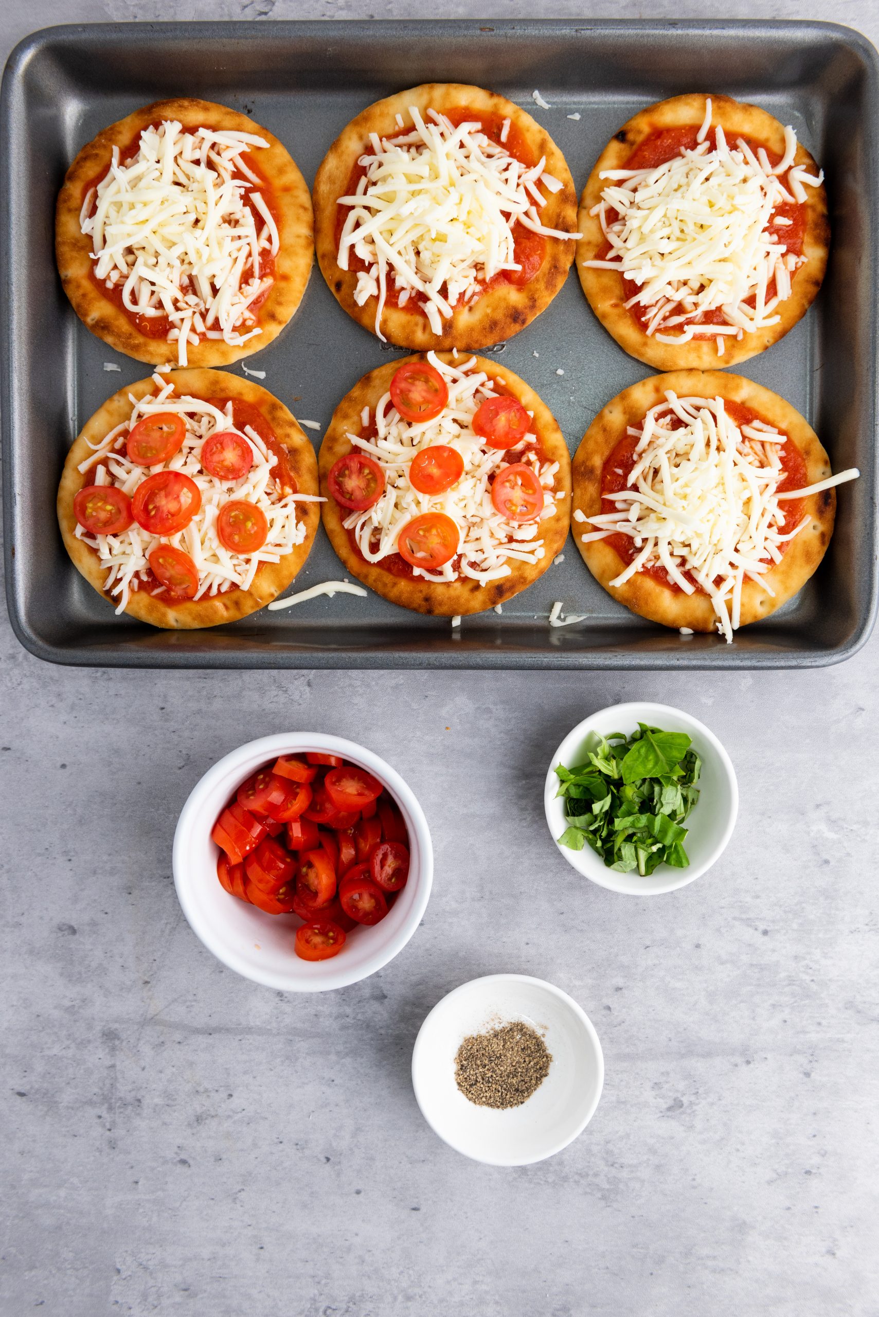 pizza with cheese, tomatoes, and sauce