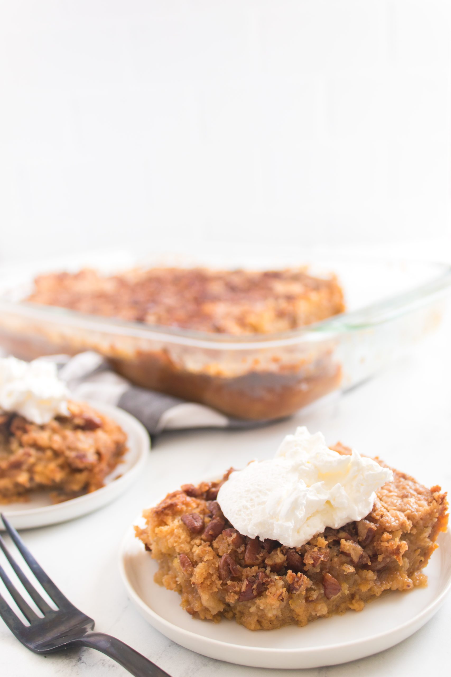 pumpkin crunch cake on a white plate