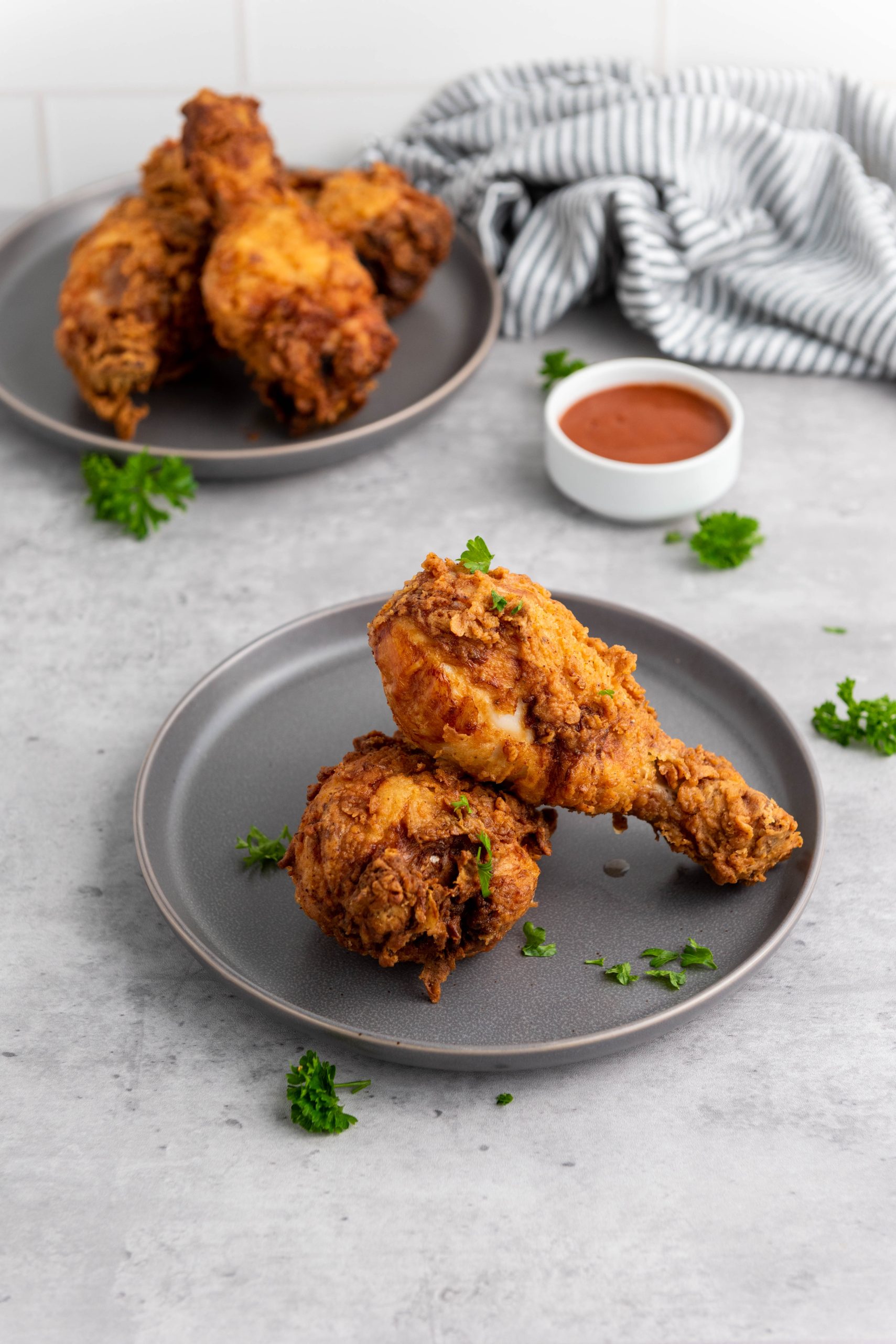 buttermilk fried chicken on a grey plate