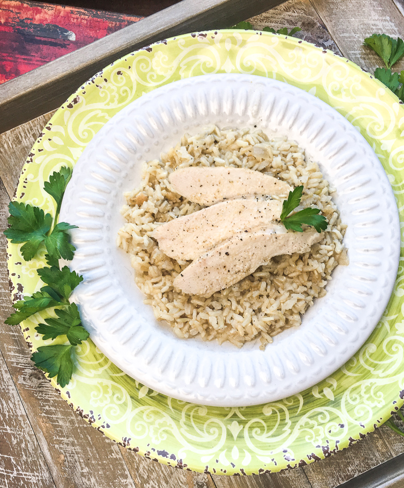 chicken and rice on a white plate