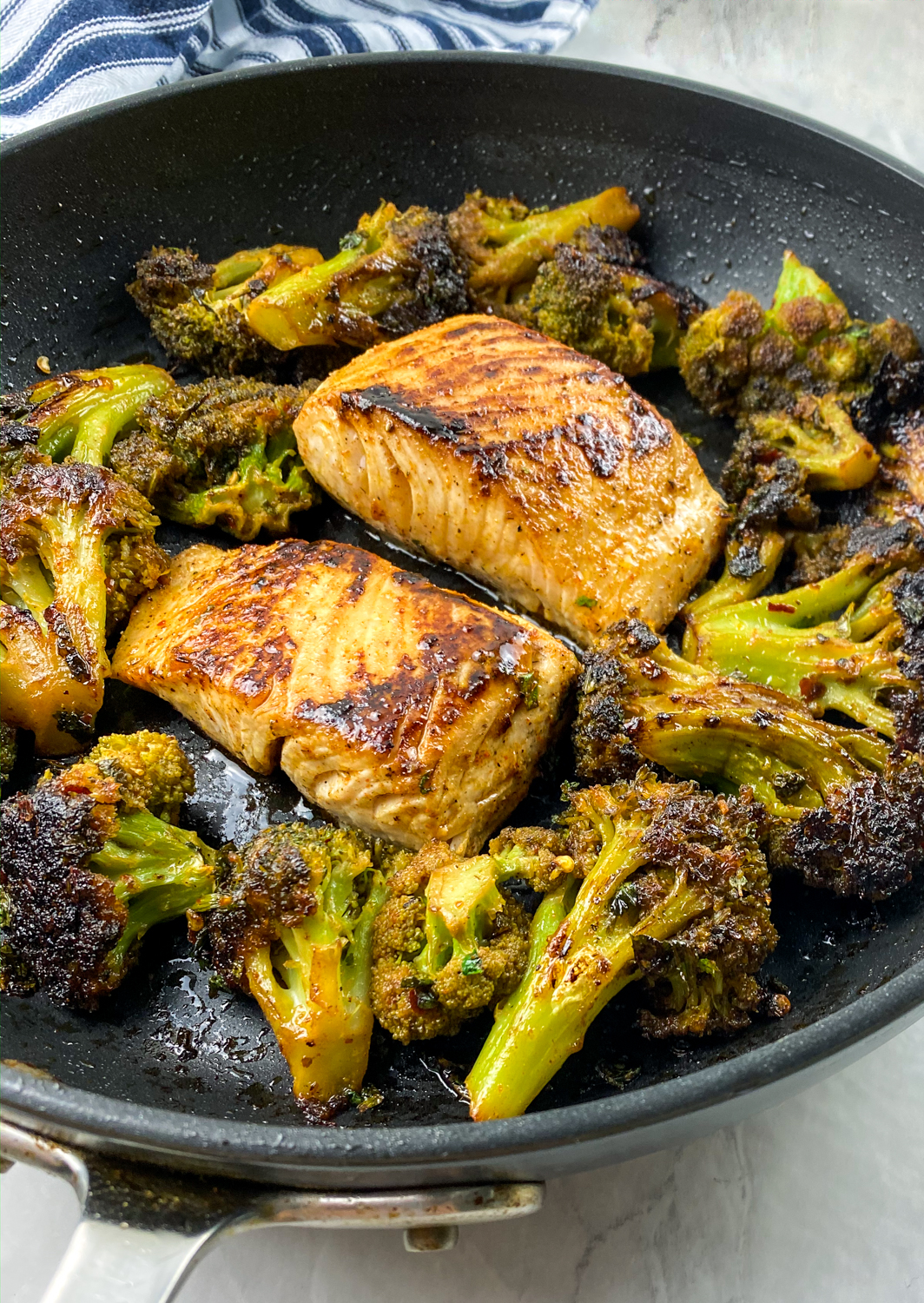 Cooking the fish and broccoli.