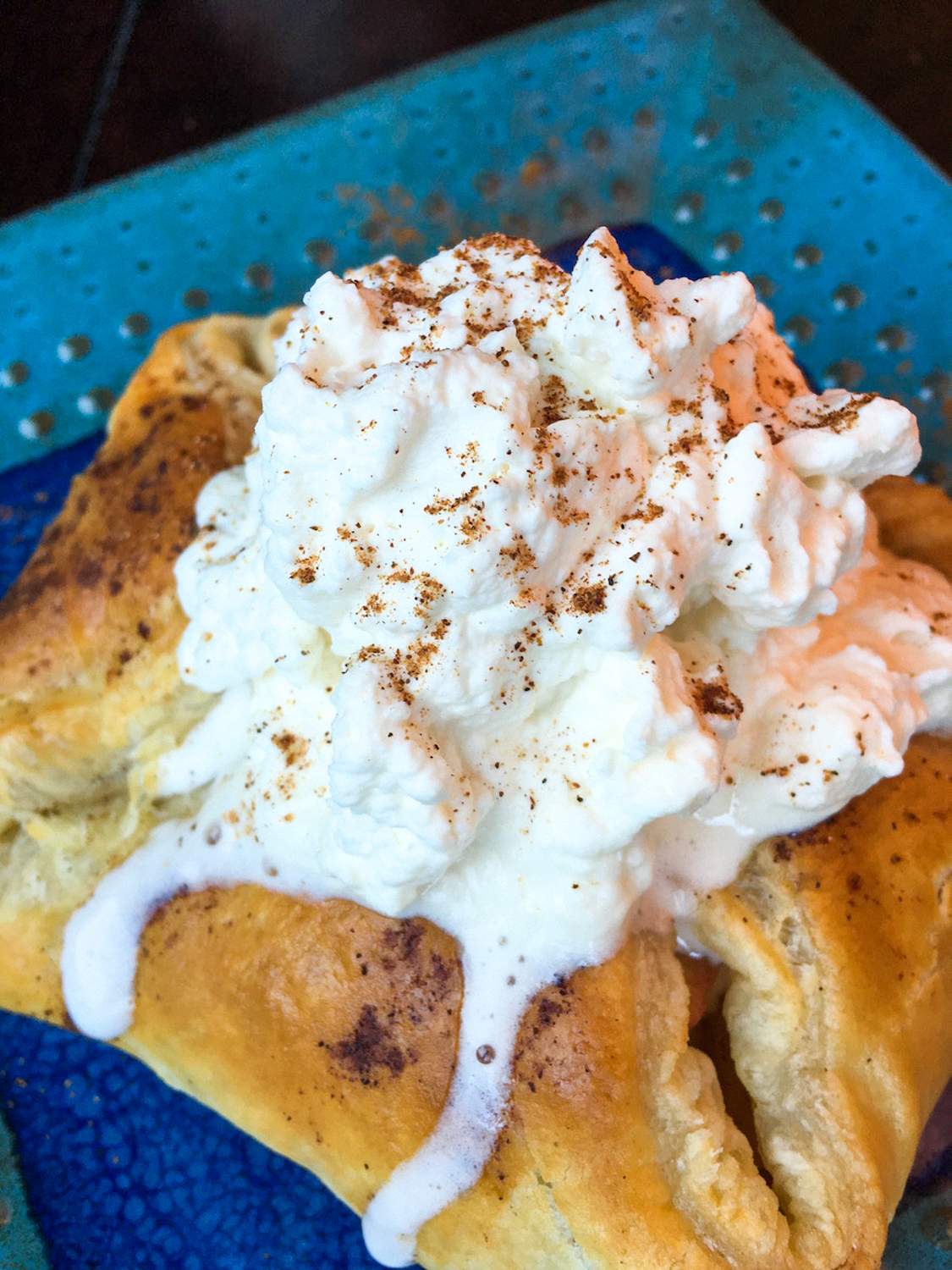 Cinnamon Apple Tarts on a blue cloth.
