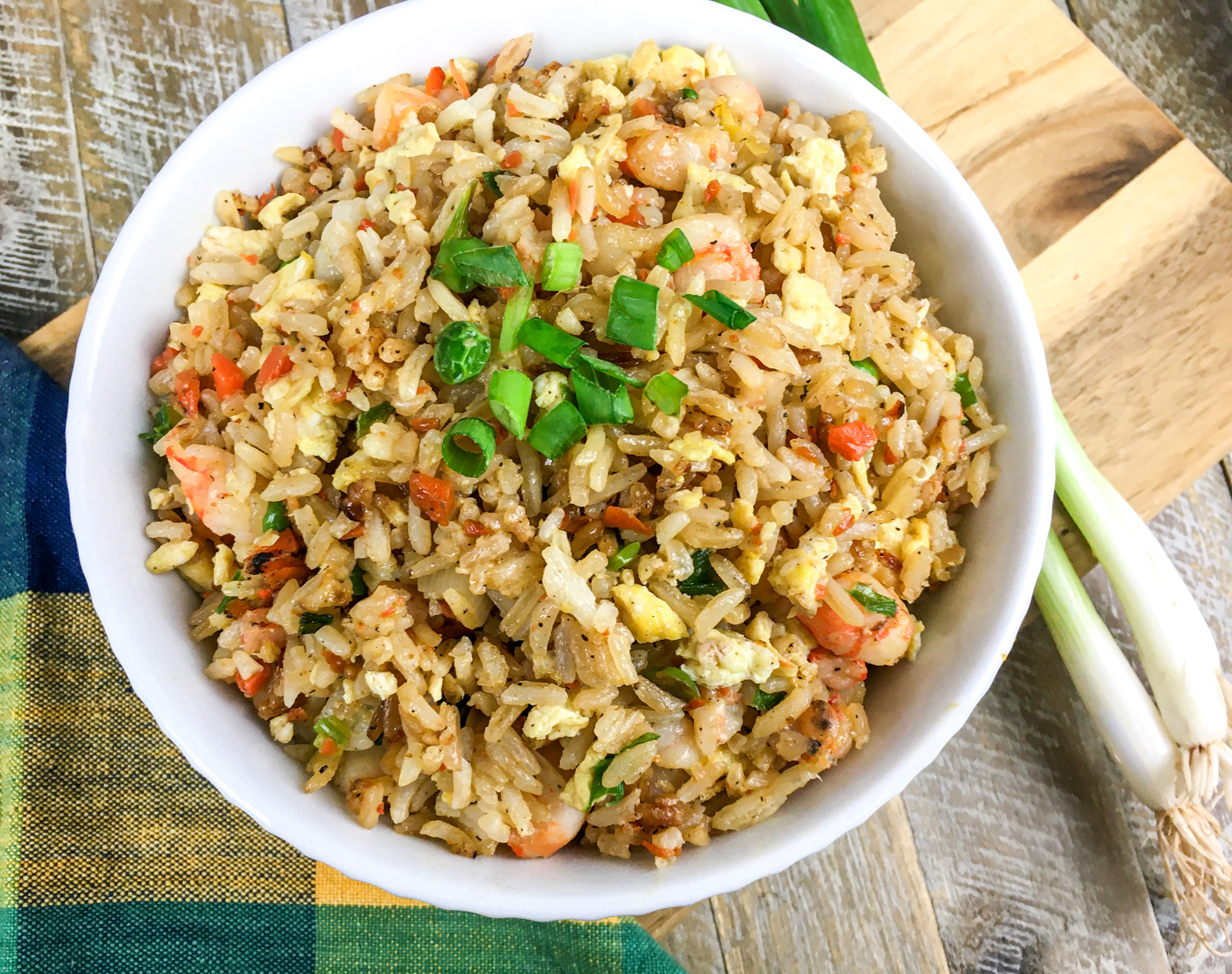 The recipe garnished with green onions in a white bowl.