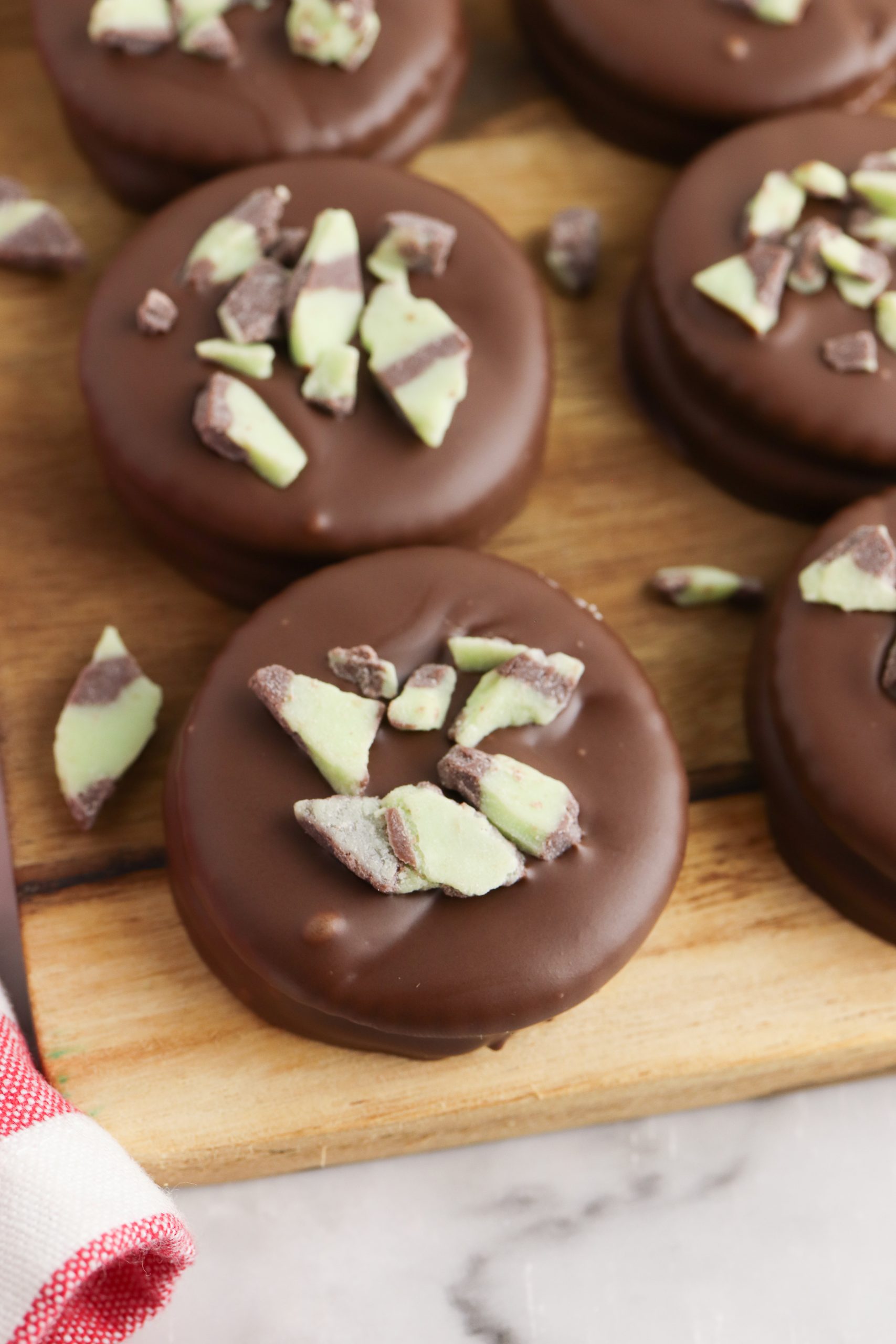 Ritz crackers thin mint cookies on a wooden board