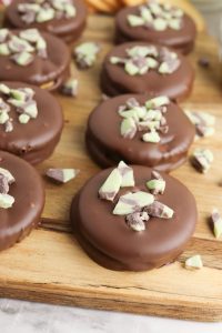 Homemade thin mint cookies with ritz crackers on a wooden board