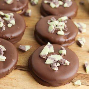 Homemade thin mint cookies with ritz crackers on a wooden board