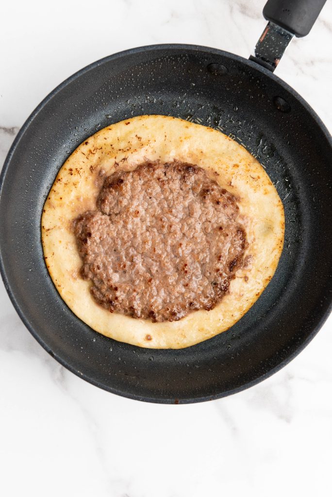 ground beef cooked on a tortilla