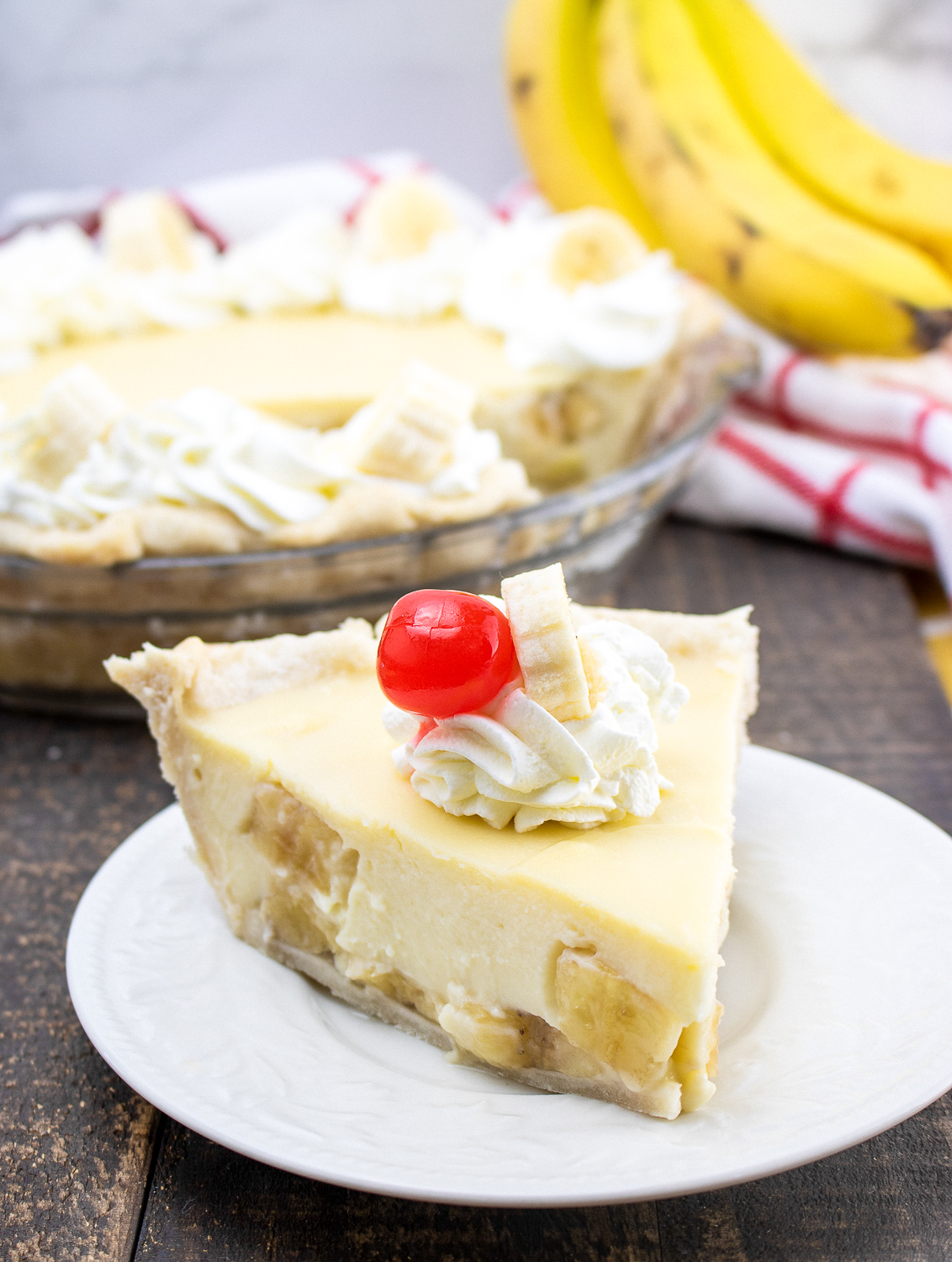 banana cream pie on a white plate