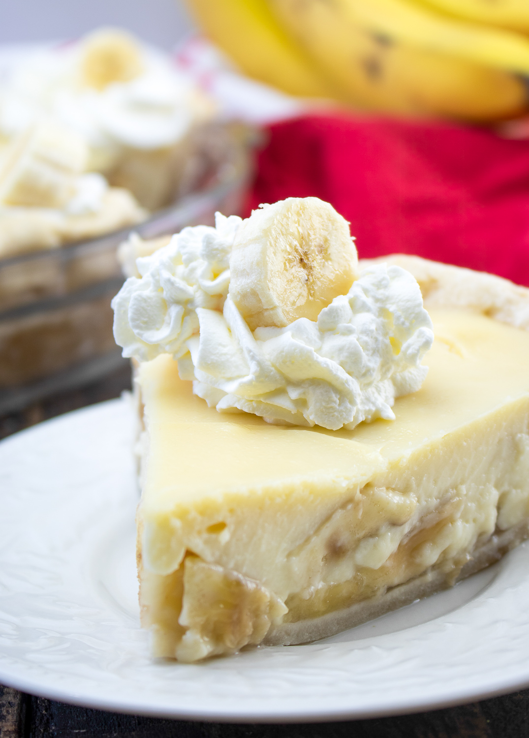 banana cream pie on a white plate